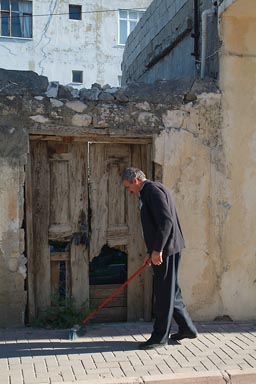 Man sweeps pavement, Silifke Turkey.